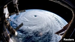 Super Typhoon Trami is seen from the International Space Station as it moves in the direction of Japan, Sept. 25, 2018 in this image obtained from social media on Sept. 26, 2018. 