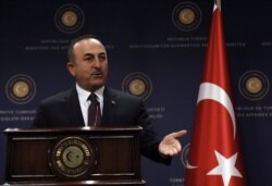 FILE - Turkey's Foreign Minister Mevlut Cavusoglu speaks during a news conference in Ankara, Turkey, Oct. 25, 2019.