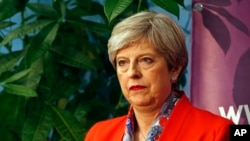 Britain's Prime Minister Theresa May listens as the declaration at her constituency is made for in the general election in Maidenhead, England, June 9, 2017. British Prime Minister Theresa May's gamble in calling an early election appeared Friday to have backfired.