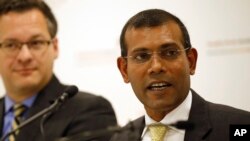 FILE - Former Maldives President Mohamed Nasheed speaks to reporters in London, Jan. 25, 2016. His party said his country's decision to leave the Commonwealth, made without consulting parliament, would damage the Maldives' standing in the international community.