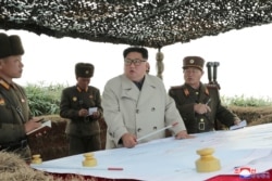 North Korean leader Kim Jong Un visits the Changrindo defensive position on the west front, in this undated picture released by North Korea's Central News Agency (KCNA), Nov. 25, 2019.