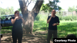 Rue Winiarzyk works with an interpreter for the deaf in Argentina. (Courtesy Rue Winiarczyk)