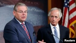 U.S. Senate Foreign Relations Committee Chairman Robert Menendez (L) and ranking member Senator Bob Corker are seen holding a news conference on Capitol Hill in Washington, D.C.