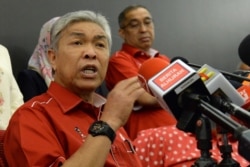 FILE - Ahmad Zahid Hamidi, Malaysia's former deputy prime minister and then-acting president of the United Malays National Organisation, speaks to reporters during a press conference in Kuala Lumpur, May 14, 2018.