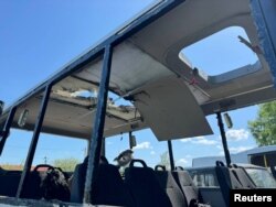 A photo provided by the governor's office of Russia's Belgorod region shows a bus that local authorities say was damaged in a Ukrainian drone attack as it was taking people to work near the village of Berezovka, May 6, 2024.