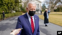 President Joe Biden speaks to reporters on the South Lawn of the White House in Washington, before boarding Marine One helicopter, Feb. 27, 2021.