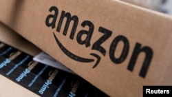 FILE - Amazon boxes are seen stacked for delivery in the Manhattan borough of New York City.