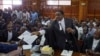 Opposition lawyer and party official James Orengo hands a letter informing him that his own passport has been suspended by the government, to the judge in the case of opposition politician Miguna Miguna, at the High Court in downtown Nairobi, Kenya, Feb. 