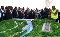 Tanzanian President John Magufuli and Egyptian Minister of Electricity and Renewable Energy Mohamed Hamed Shaker attend the launch of the construction of the Rufiji Hydro Power project near Dar es Salaam, Tanzania, July 26, 2019.