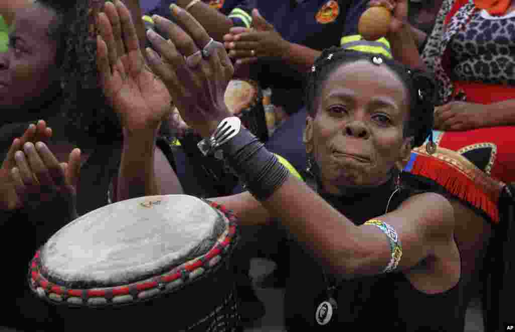 Women take part in a drumming session to protest violence against women and children, Johannesburg, South Africa, March 8, 2013. 