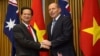 Vietnamese Prime Minister Nguyen Tan Dung and his Australian counterpart Tony Abbott shake hands before witnessing the signing of a "friendship agreement" between their countries at Parliament House in Canberra, Australia, March 18, 2015.