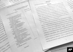 A portion of the Feb. 16, indictment against Russia's Internet Research Agency is photographed in Washington, March 15, 2018.