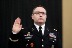 National Security Council aide Lt. Col. Alexander Vindman is sworn in to testify before the House Intelligence Committee on Capitol Hill in Washington, Nov. 19, 2019.