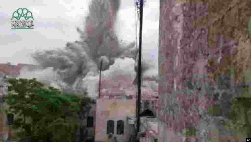This scene taken from amateur video shows an explosion that destroyed the Carlton Hotel in Aleppo, May 8, 2014.