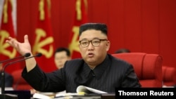 In this image distributed by the North Korean government, North Korean leader Kim Jong Un speaks during the 3rd Plenary Meeting of the 8th Central Committee of the Workers' Party of Korea in Pyongyang, North Korea, June 17, 2021.