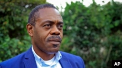 FILE - Congo's then-Health Minister Oly Ilunga speaks to a reporter in Beni, Democratic Republic of Congo, Dec. 20, 2018. 