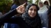 A young voter shows with pride proof she took part in Egypt's first widely contested presidential election, May 23, 2012. (Yuli Weeks/VOA)