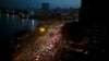FILE - Traffic moves besides the Saigon river during rush hour in Ho Chi Minh City, Vietnam, Nov. 18, 2015. Senior officials warn air pollution levels in Ho Chi Minh City and Hanoi alone could soon match the deteriorating air quality of Beijing.