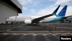 FILE - A Garuda Boeing 737 Max 8 airplane is parked at the Garuda Maintenance Facility AeroAsia, at Soekarno-Hatta International airport near Jakarta, Indonesia, March 13, 2019.