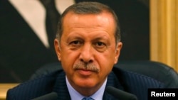 FILE - Turkey's Prime Minister Tayyip Erdogan addresses the media in Ankara, Aug. 15, 2013. 