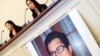 FILE - Zhang Qing, left, wife of Chinese human rights activist Guo Feixiong, and daughter Yang Tianjiao speak at a press conference before a hearing of a House Foreign Affairs Committee subcommittee in Washington, D.C., October 29, 2013.