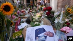 His picture and flowers mark the spot where journalist Peter R. de Vries was shot earlier last week in Amsterdam, Netherlands, July 8, 2021.