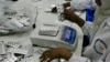 Employees inspect medication tablets produced at Azal Pharmaceutical Industries in Khartoum, (File photo).