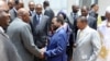 Mali's interim leader Dioncounda Traore (C) shakes hands with government members during the first council of Ministers of Mali's new government at the Koulouba presidential palace in Bamako on May 9, 2012.