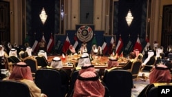 Kuwait's emir, Sheikh Sabah Al Ahmad Al Sabah, center, oversees the Gulf Cooperation Council summit in Kuwait City, Tuesday, Dec. 5, 2017. Kuwait hosted a meeting Tuesday of the Gulf Cooperation Council that saw Qatar's ruling emir attend, but other…