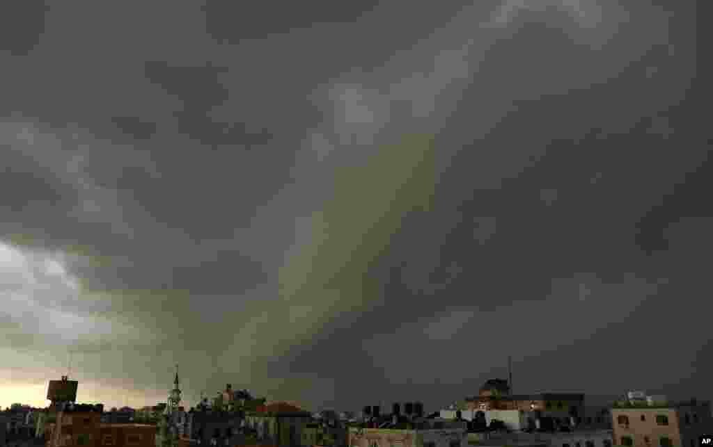 Dark clouds over Gaza City, Dec. 13, 2013. Early snow surprised many Israelis and Palestinians as a blustery storm, dubbed Alexa, brought gusty winds, torrential rains and heavy snowfall to parts of the Middle East.