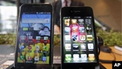 Samsung Electronics' Galaxy S, left, and Apple's iPhone 4 are displayed. South Korea's Samsung Electronics Co. says it sued Apple Inc. for patent rights violations, only days after Apple sued Samsung for the same reason, (File)