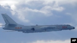 In this photo released by the Taiwan Ministry of National Defense, a Chinese People's Liberation Army H-6 bomber is seen flying near the Taiwan air defense identification zone, ADIZ, near Taiwan on Friday, Sept. 18, 2020. The second high-level U.S…