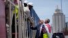 FILE - U.S. President Joe Biden and Chief Operating Officer of Lobito Atlantic Railway Nicolas Gregoire meet rail workers during a tour of the Lobito Port Terminal in Lobito, Angola, Dec. 4, 2024.