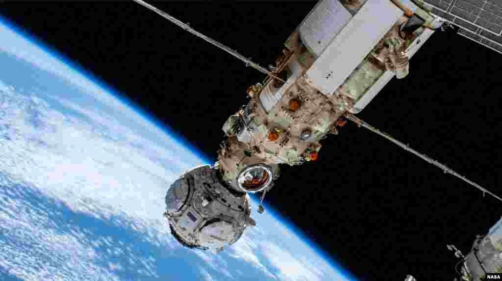 Roscosmos cosmonaut and Expedition 66 Commander Anton Shkaplerov, upper right, works outside the Nauka multipurpose laboratory module during a spacewalk that lasted seven hours and 11 minutes, Jan. 19, 2022. (Photo courtesy of NASA Johnson via flickr)