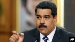 Venezuelan President Nicolas Maduro speaks during a news conference at Miraflores Presidential Palace in Caracas, Dec. 30, 2014.
