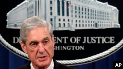 FILE - Then-special counsel Robert Mueller talks to reporters about the Russia probe in this undated photo.