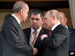 Turkish President Recep Tayyip Erdogan, left, speaks to Russian President Vladimir Putin, right, as he leaves after their meeting in Putin's residence in the Russian Black Sea resort of Sochi, Russia, May 3, 2017.