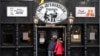 A restaurant demands the 2G rule, that means only vaccinated or recovered customers are allowed to enter in Cologne, Germany, Jan. 7, 2022. New