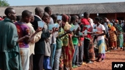 Burundians wait in line to vote during the presidential and general elections in Ngozi, northern Burundi, May 20, 2020. 