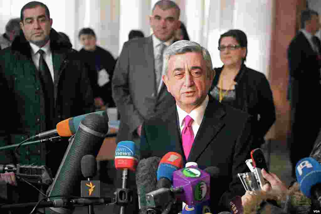 Armenia's President Serzh Sargsyan talks to reporters after voting in Yerevan. (V. Undritz/VOA)