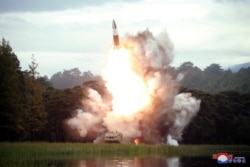 FILE - North Korea test-fires a weapon in this undated photo released Aug. 16, 2019, by the Korean Central News Agency. Pyongyang conducted another launch Aug. 23, violating an apparent promise to U.S. President Donald Trump.