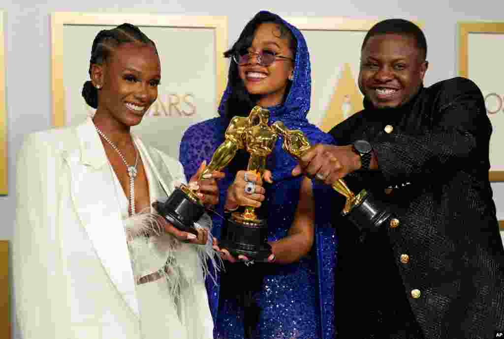 Tiara Thomas, from left, H.E.R. and Dernst Emile II, winners of the award for best original song for "Fight For You" from "Judas and the Black Messiah," pose in the press room at the Oscars on Sunday, April 25, 2021, at Union Station in Los Angeles…