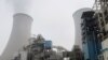 Water vapour rises from a cooling tower of a China Energy ultra-low emission coal-fired power plant during a media tour, Feb. 2, 2021.