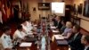FILE - Philippine and U.S. negotiators discussing U.S. troop presence in the Philippines are seen meeting at the Department of National Defense headquarters in Quezon city, north of Manila.