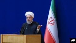 Le président iranien Hassan Rouhani s'exprime lors d'une cérémonie marquant la journée nationale de l'énergie nucléaire du pays, à Téhéran (Iran), le 7 avril 2016. Iranian Presidency Office via AP)