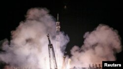 The Soyuz TMA-14M spacecraft carrying the International Space Station crew of Barry Wilmore of the U.S., and Alexander Samokutyaev and Elena Serova of Russia blasts off from the launch pad at the Baikonur cosmodrome, September 26, 2014.