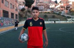 Amateur soccer player Aldair Hermoso poses for a portrait on the field La Paz, Bolivia, Sept. 24, 2019.