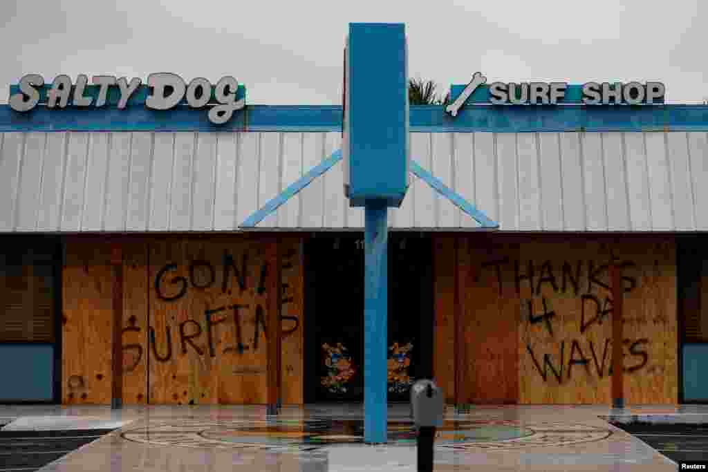 A message written on a closed business is pictured as Hurricane Michael approaches Panama City Beach, Florida, Oct. 10, 2018.