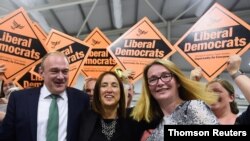 Liberal Democrats candidate Jane Dodds, center, reacts after winning the by-election for the district of Brecon and Radnorshire at the Royal Welsh Showground, near Builth Wells in Wales, Britain Aug. 2, 2019. 
