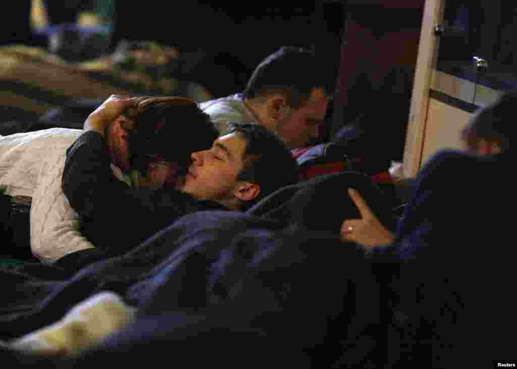Protesters rest inside Kyiv's City Hall building, Dec. 6, 2013.